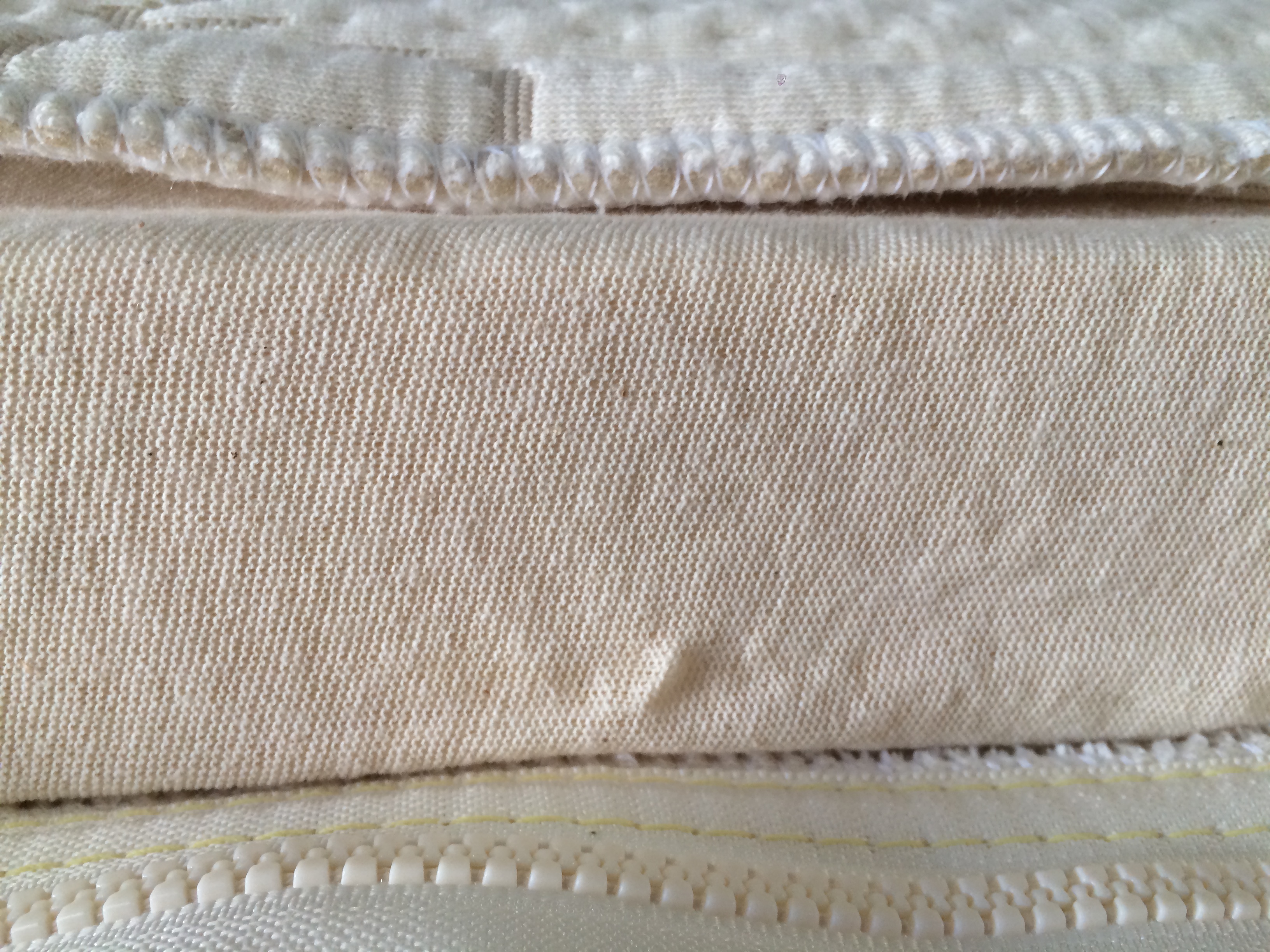 we cover each piece latex bedding piece in a certified organic cotton knit sock